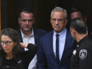 FILE - Independent presidential candidate Robert F. Kennedy Jr., center right, leaves the Albany County Courthouse, Aug. 6, 2024, in Albany, N.Y.