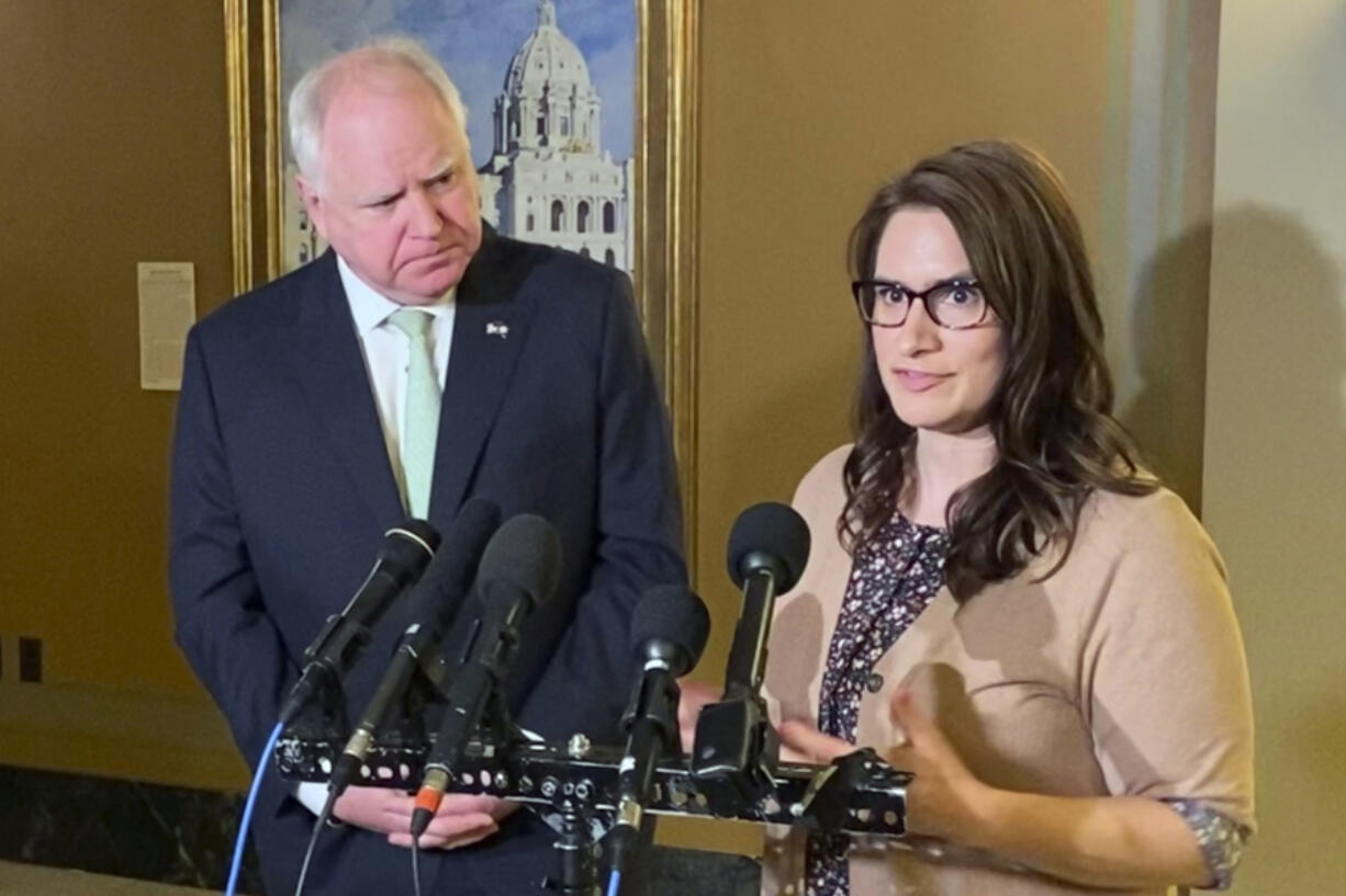 FILE - Minnesota Lt. Gov. Peggy Flanagan, right, and Gov. Tim Walz speak to reporters at the State Capitol in St. Paul, Minn., Monday, March 21, 2022.