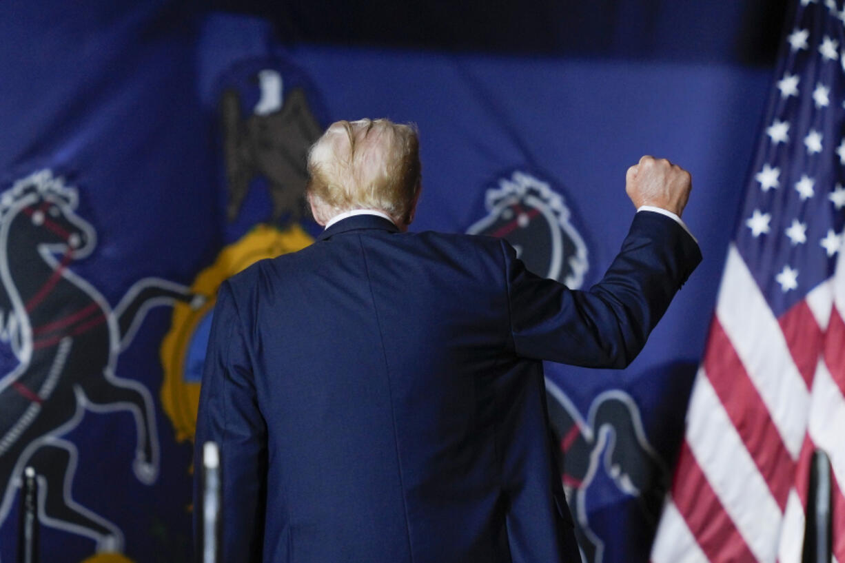 Republican presidential candidate former President Donald Trump gestures as he walks off stage after speaking at a campaign rally in Harrisburg, Pa., Wednesday, July 31, 2024.