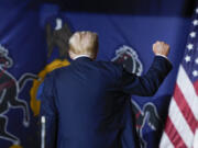 Republican presidential candidate former President Donald Trump gestures as he walks off stage after speaking at a campaign rally in Harrisburg, Pa., Wednesday, July 31, 2024.