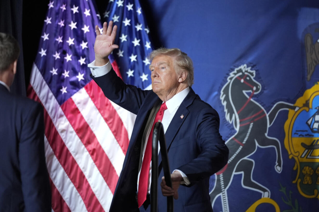 Republican presidential candidate former President Donald Trump gestures to the crowd after speaking at a campaign rally, Wednesday, July 31, 2024, in Harrisburg, Pa.