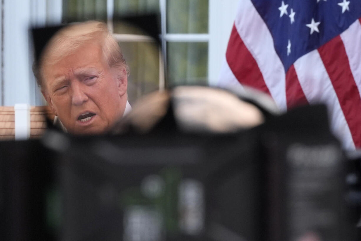 Republican presidential nominee former President Donald Trump, seen through a television lens, speaks at a news conference at Trump National Golf Club, Thursday, Aug. 15, 2024, in Bedminster, N.J.