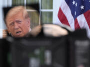 Republican presidential nominee former President Donald Trump, seen through a television lens, speaks at a news conference at Trump National Golf Club, Thursday, Aug. 15, 2024, in Bedminster, N.J.