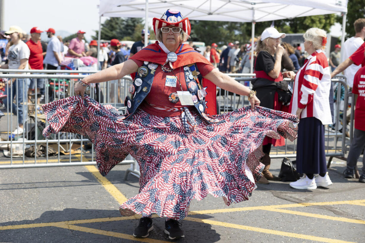 Susan Reneau, 72, of Missoula, Mont., arrives before Republican presidential nominee former President Donald Trump speaks at a campaign rally in Bozeman, Mont., Friday, Aug. 9, 2024.