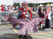 Susan Reneau, 72, of Missoula, Mont., arrives before Republican presidential nominee former President Donald Trump speaks at a campaign rally in Bozeman, Mont., Friday, Aug. 9, 2024.