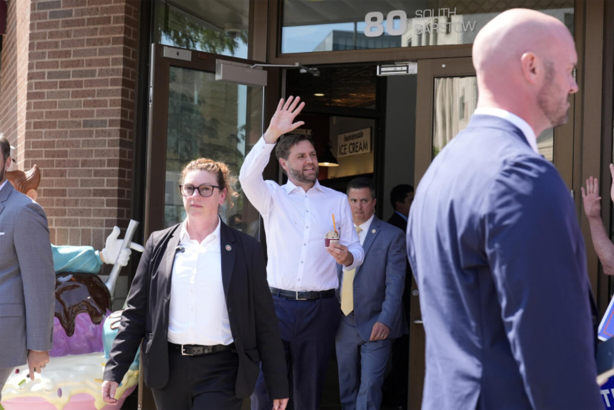 Republican vice presidential nominee Sen. JD Vance, R-Ohio, waves as he leaves with ice cream at Olson&#039;s Ice Cream Wednesday, Aug. 7, 2024, in Eau Claire, Wis.