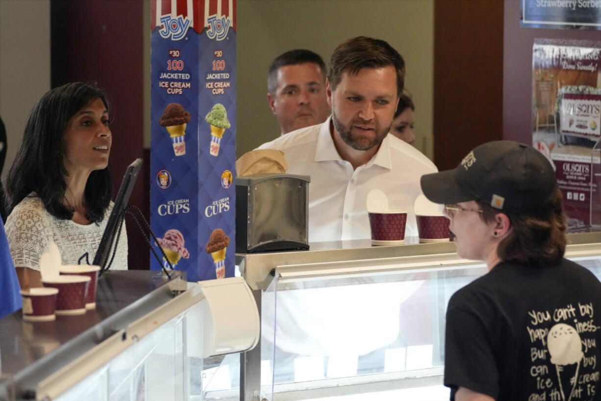 Republican vice presidential nominee Sen. JD Vance, R-Ohio, and his wife Usha Chilukuri Vance order ice cream at Olson&rsquo;s Ice Cream Wednesday, Aug. 7, 2024, in Eau Claire, Wis.