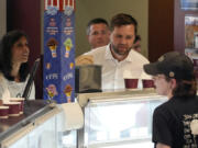 Republican vice presidential nominee Sen. JD Vance, R-Ohio, and his wife Usha Chilukuri Vance order ice cream at Olson&rsquo;s Ice Cream Wednesday, Aug. 7, 2024, in Eau Claire, Wis.