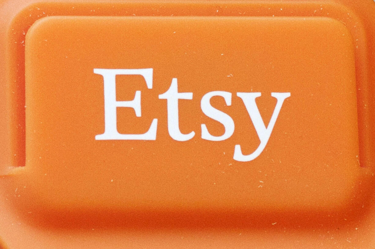 FILE - The Etsy logo is appears on a mobile credit card reader, on Jan. 6, 2015 in New York. Etsy said on Wednesday, July 31, 2024, it will begin testing its first-ever loyalty program in September, a move designed to boost sluggish sales and draw in infrequent shoppers.