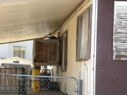 The mobile home where Shirley Kouplen lived shown Thursday, May 23, 2024, in Phoenix. Her mobile home cooling system stopped working during the sweltering heatwave of 2023, and by the time emergency responders arrived, the 70-year-old widow&rsquo;s temperature was 107.1 degrees, was diagnosed with heat stroke, suffered several heart attacks and later died at a local hospital. (AP Photo/Ross D.