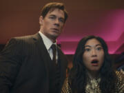 This image released by Prime Video shows John Cena, left, and Awkwafina in a scene from &ldquo;Jackpot!&rdquo; (Prime Video via AP)