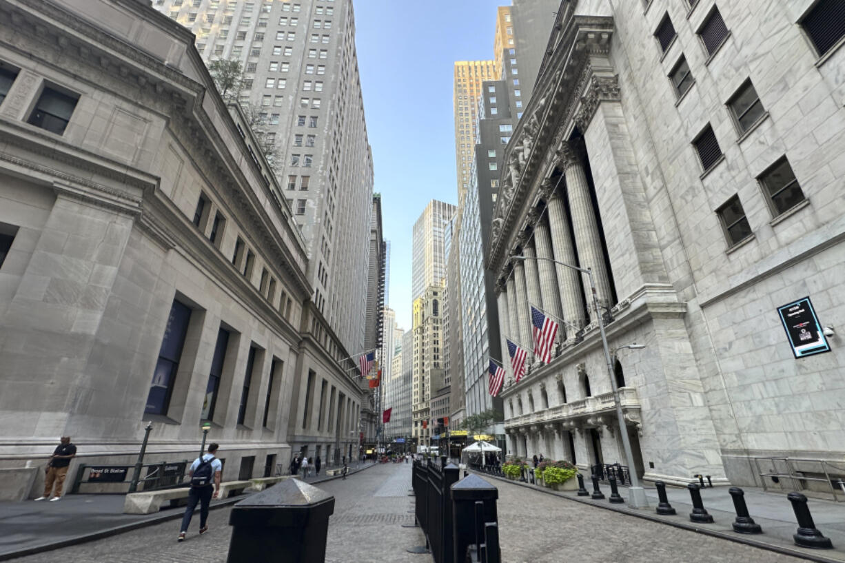 The New York Stock Exchange, at right, is shown on Wednesday, Aug. 14, 2024, in New York.