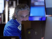 FILE - Trader John Romolo works on the floor of the New York Stock Exchange, Aug. 2, 2024. Japan&#039;s benchmark Nikkei 225 stock index has lost 12.4% on Monday, August 5, 2024, in the latest bout of sell-offs that are jolting world markets.