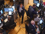 Traders work on the floor of the New York Stock Exchange, Monday, Aug. 5, 2024.