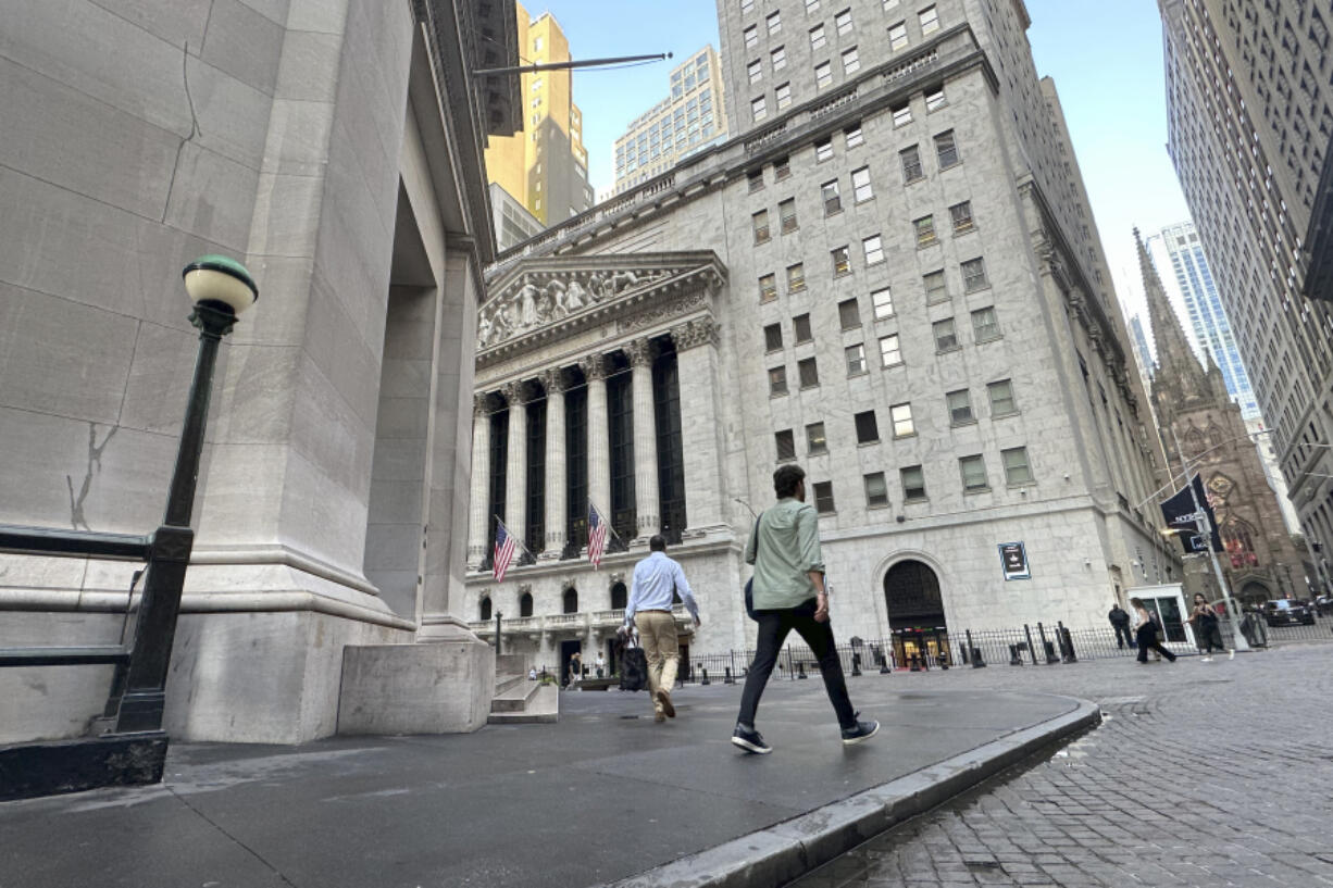 FILE - People approach the New York Stock Exchange on Aug. 27, 2024, in New York.