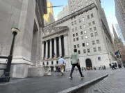 FILE - People approach the New York Stock Exchange on Aug. 27, 2024, in New York.