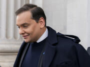 FILE - Rep. George Santos, R-N.Y., leaves the Capitol after being expelled from the House of Representatives, Friday, Dec. 1, 2023, in Washington.