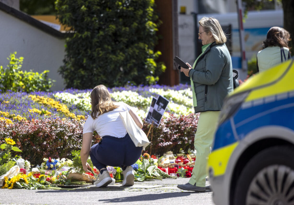 Flowers and candles are placed in Solingen, Germany, Sunday, Aug. 25, 2024, near the scene of Friday&#039;s deadly attack.