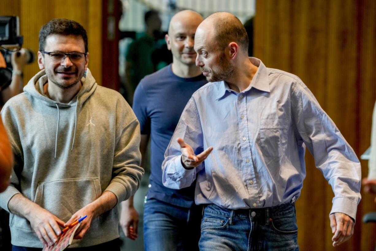 Freed Russian prisoners Ilya Yashin, from left, Andrei Pivovarov and Vladimir Kara-Murza, approach a press conference in Bonn, Germany, Friday, Aug. 2, 2024, a day after they were released as part of a 24-person prisoner swap between Russia and the United States.