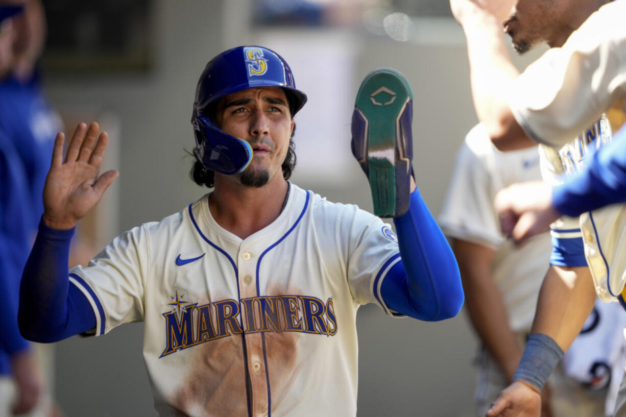 Seattle Mariners&#039; Josh Rojas reacts after scoring against the San Francisco Giants during the fifth inning of a baseball game, Sunday, Aug. 25, 2024, in Seattle.