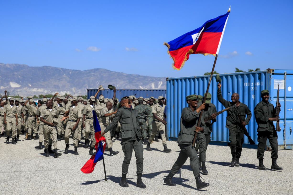 FILE - New members of the Armed Forces of Haiti celebrate after their graduation ceremony in Port-au-Prince, Haiti, Thursday, Dec. 22, 2022.