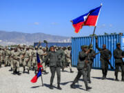 FILE - New members of the Armed Forces of Haiti celebrate after their graduation ceremony in Port-au-Prince, Haiti, Thursday, Dec. 22, 2022.