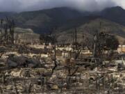 FILE - Damaged property lies scattered in the aftermath of a wildfire in Lahaina, Hawaii, Aug. 21, 2023. A Maui judge&rsquo;s ruling Tuesday, Aug. 13, 2024, resolves a critical roadblock to finalizing a $4 billion wildfire settlement. (AP Photo/Jae C.