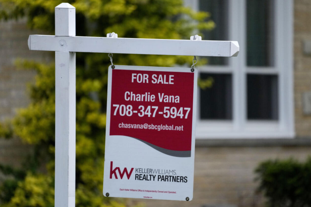 FILE - A for sale sign is displayed in front of a home in Wheeling, Ill., on May 2, 2024. (AP Photo/Nam Y.