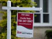 FILE - A for sale sign is displayed in front of a home in Wheeling, Ill., on May 2, 2024. (AP Photo/Nam Y.