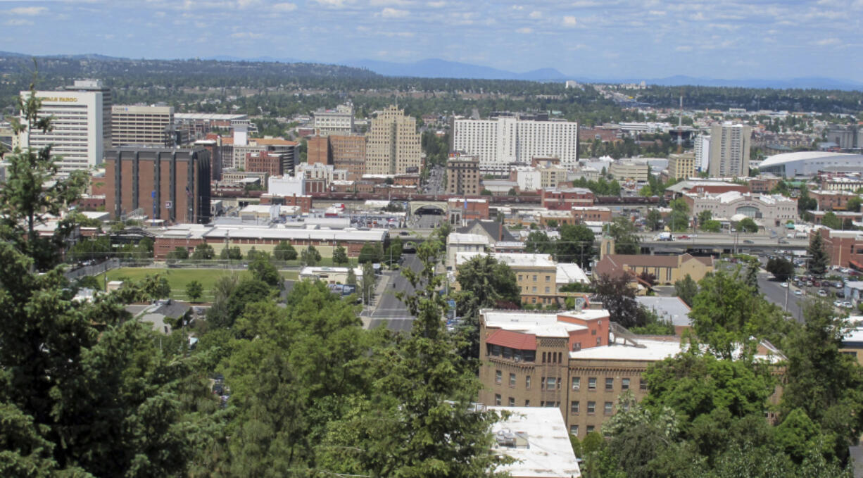 FILE - The downtown skyline is shown from the South Hill in Spokane, Wash., on June 4, 2018. The American Civil Liberties Union of Washington has sued the city of Spokane, alleging that its anti-homeless laws violate the state constitution. The group filed the suit on Thursday, Aug. 1, 2024, on behalf of a currently homeless person and someone who was formerly homeless. (AP Photo/Nicholas K.