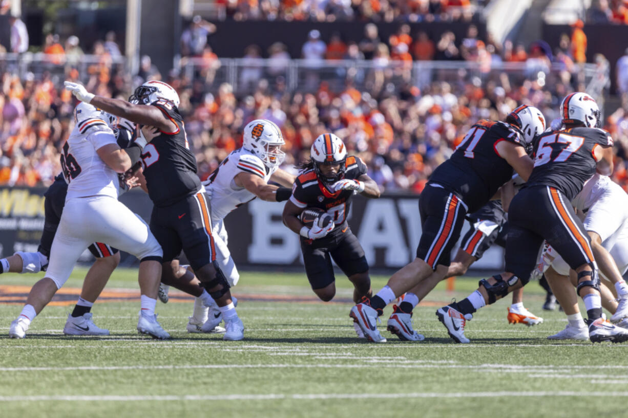 Oregon State running back Anthony Hankerson (0) breaks it up the middle during an NCAA college football game against Idaho State in Corvallis, Ore., Saturday, Aug. 31, 2024.