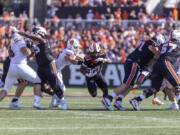 Oregon State running back Anthony Hankerson (0) breaks it up the middle during an NCAA college football game against Idaho State in Corvallis, Ore., Saturday, Aug. 31, 2024.