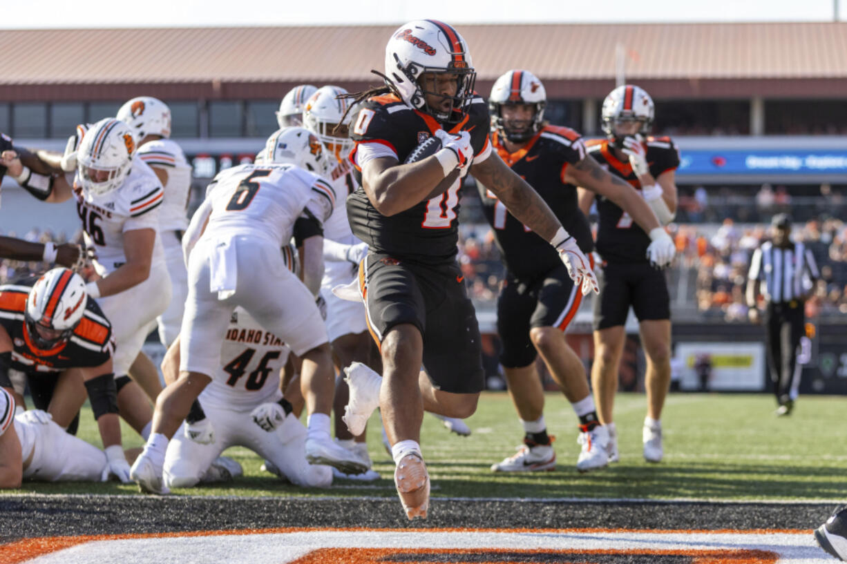 Oregon State running back Anthony Hankerson (0) finds the end zone for a touchdown during an NCAA college football game against Idaho State in Corvallis, Ore., Saturday, Aug. 31, 2024.