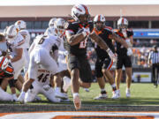 Oregon State running back Anthony Hankerson (0) finds the end zone for a touchdown during an NCAA college football game against Idaho State in Corvallis, Ore., Saturday, Aug. 31, 2024.