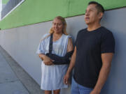 Roberto Garcia and his wife Maria Garcia pause for a picture after dropping their two children off for their first day of school in East Los Angeles on Wednesday, Aug. 14, 2024.