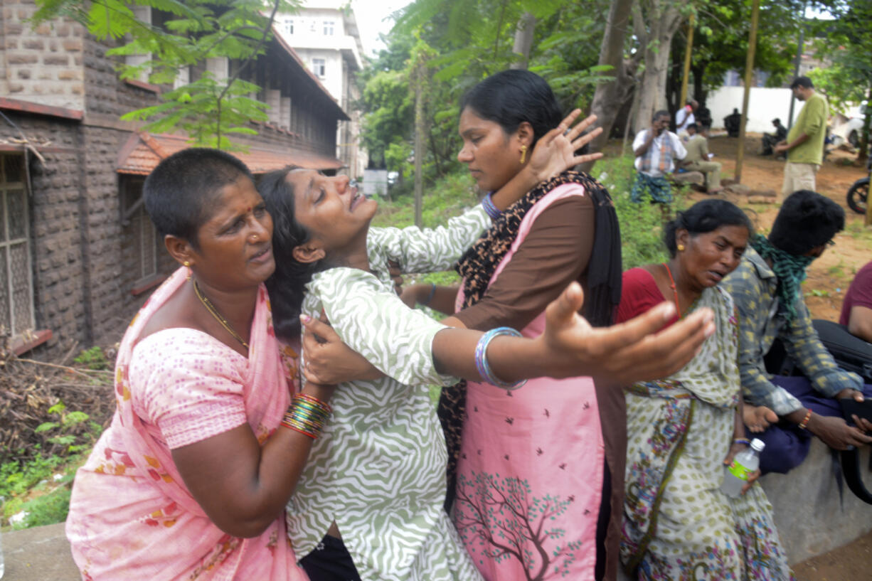 Leela Devi, center, with her arms outstretched, wails after hearing of her husband Chiranjeevi&rsquo;s death in an explosion at the Escientia Advanced Sciences Private Ltd., a pharmaceutical company, outside the mortuary of King George Hospital in Visakhapatnam, Andhra Pradesh state, India, Thursday, Aug. 22, 2024.