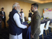 FILE- In this photo provided by the Ukrainian Presidential Press Office, Ukraine President Volodymyr Zelenskyy, right, and Indian Prime Minister Narendra Modi meet at the Grand Prince Hotel, during the G7 Summit in Hiroshima, Japan, May 20, 2023.