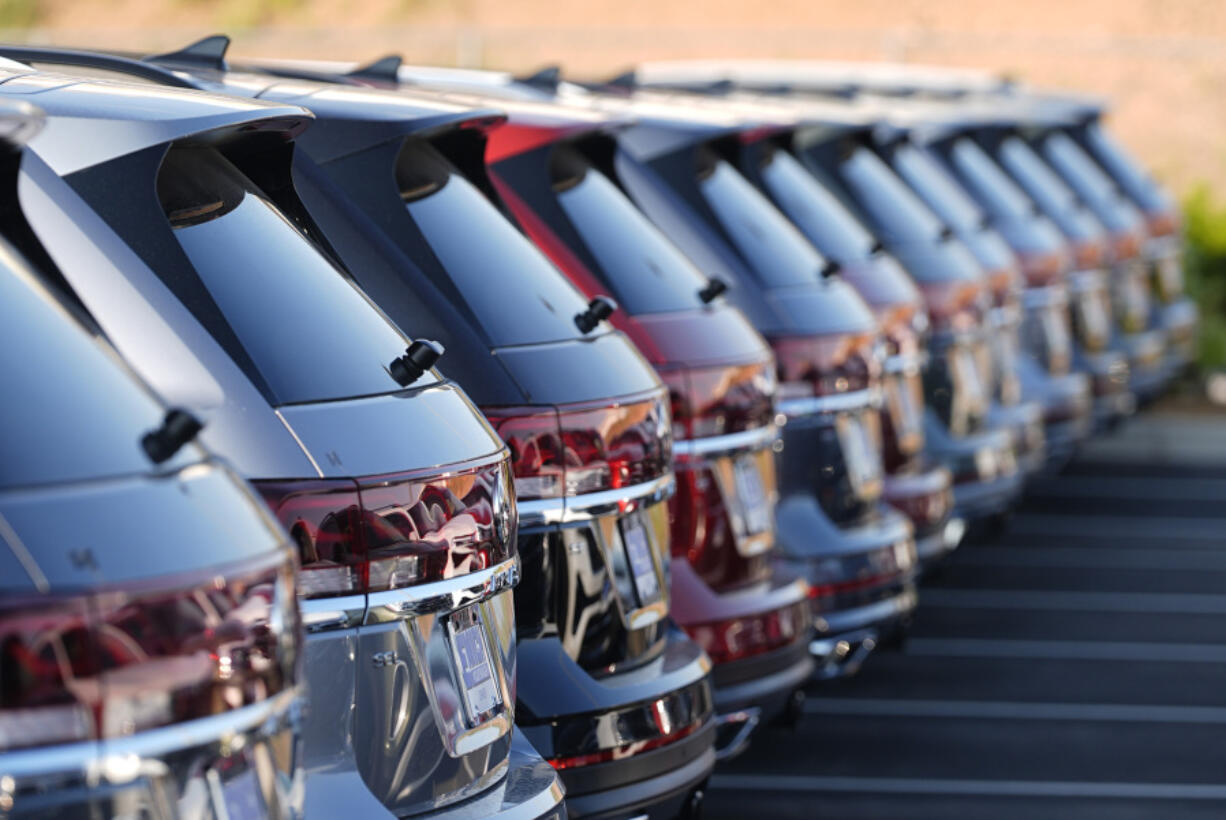 A long row of unsold 2024 Atlas utility vehicles is shown Sunday, July 28, 2024, at a Volkswagen dealership in Denver.