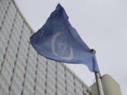 FILE - The flag of the International Atomic Energy Agency flies in front of its headquarters during an IAEA Board of Governors meeting in Vienna, Austria, on Feb. 6, 2023.