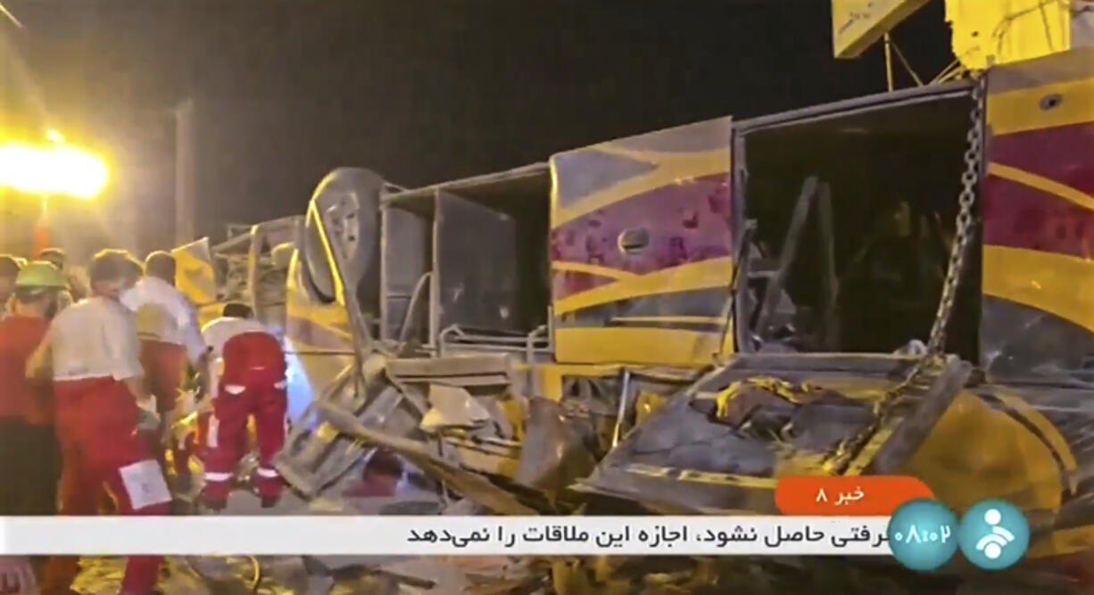 This image taken from a video released by Iranian state television shows the aftermath of a bus crash near Taft, Iran, early Wednesday, Aug. 21, 2024. A bus carrying Shiite pilgrims from Pakistan to Iraq crashed in central Iran, killing multiple people, an official said Wednesday.