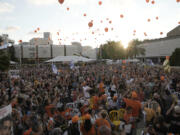 Family, friends and supporters of Ariel Bibas, who is held hostage by Hamas in the Gaza Strip, release orange balloons to mark his fifth birthday in Tel Aviv, Israel, Monday, Aug. 5, 2024. Ariel Bibas, who along with his 1-year-old brother Kfir, has become a symbol of the struggle to free the hostages who remain captive in Gaza. The orange balloons are meant to symbolize Ariel and Kfir&rsquo;s bright red hair.