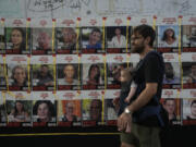 Posters of hostages taken on Oct. 7, 2023 in southern Israel by Hamas militants to the Gaza Strip, are displayed in Tel Aviv, Israel, Saturday, Aug. 17, 2024.