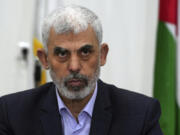 FILE - Yahya Sinwar chairs a meeting with leaders of Palestinian factions at his office in Gaza City, April 13, 2022.