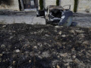 A torched vehicle, seen the morning after a rampage by Israeli settlers in the West Bank village of Jit, Friday, Aug. 16, 2024.