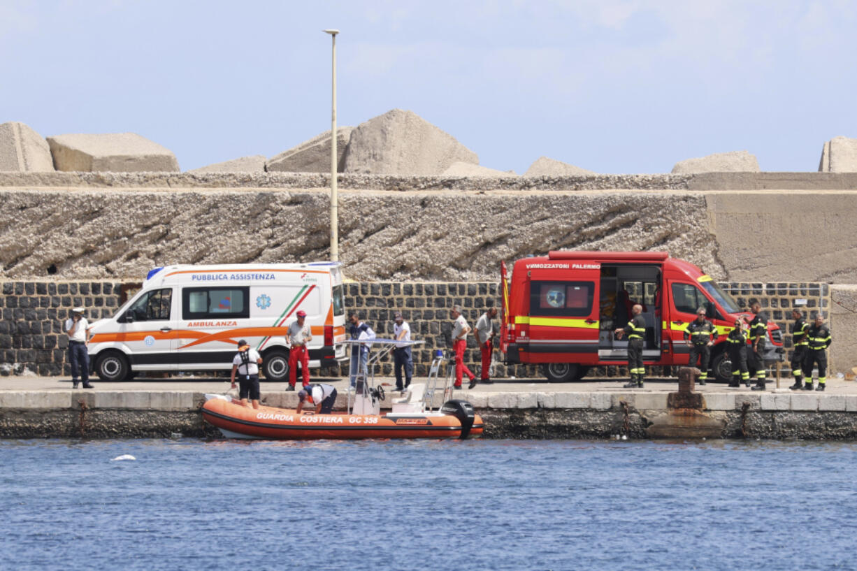 Emergency services at the scene of the search for a missing boat, in Porticello Santa Flavia, Italy, Monday, Aug. 19, 2024. British tech giant Mike Lynch, his lawyer and four other people are among those missing after their luxury superyacht sank during a freak storm off Sicily, Italy&rsquo;s civil protection and authorities said. Lynch&rsquo;s wife and 14 other people survived.