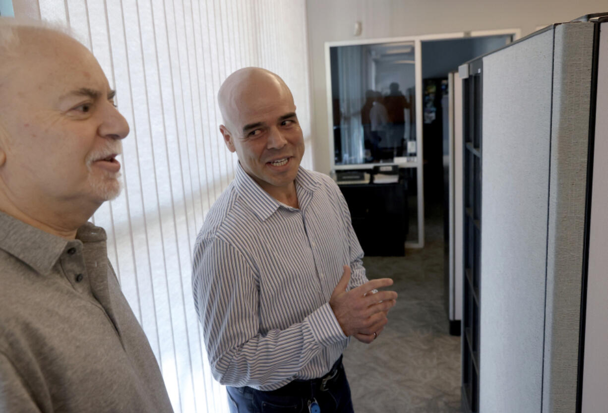 FILE - Clark County Public Administrator Robert Telles, right, talks to Las Vegas Review-Journal reporter Jeff German in his Las Vegas office, on May 11, 2022. (K.M.