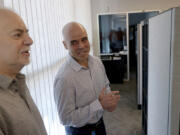 FILE - Clark County Public Administrator Robert Telles, right, talks to Las Vegas Review-Journal reporter Jeff German in his Las Vegas office, on May 11, 2022. (K.M.