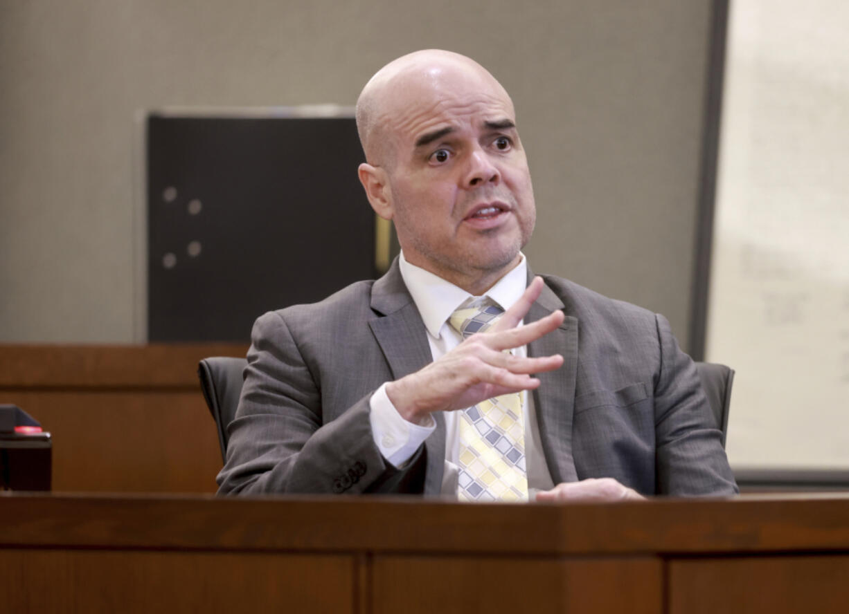 Robert Telles shows how he cut his finger while speaking to the jury from the witness stand on the eighth day of his murder trial at the Regional Justice Center in Las Vegas Wednesday, August 21, 2024. Telles, a former Clark County public administrator, is charged in the murder of Las Vegas Review-Journal investigative journalist Jeff German. (K.M.