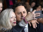 Giovanni Ribisi, right, director of photography on &ldquo;Strange Darling,&rdquo; poses for a selfie with actor Frances Fisher at the premiere of the film at the Directors Guild of America, Monday, Aug. 19, 2024, in Los Angeles.