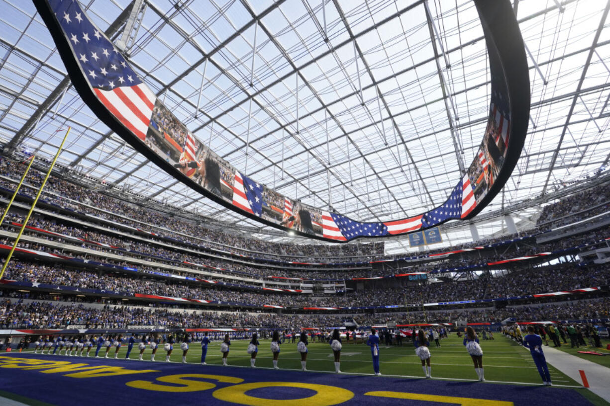 FILE - National anthem wide angle cheerleaders Los Angeles Rams SoFi Stadium of an NFL football game against the Pittsburgh Steelers, Sunday, Oct. 22, 2023, in Inglewood, Calif. As the Olympics close in Paris, Los Angeles will take the torch.